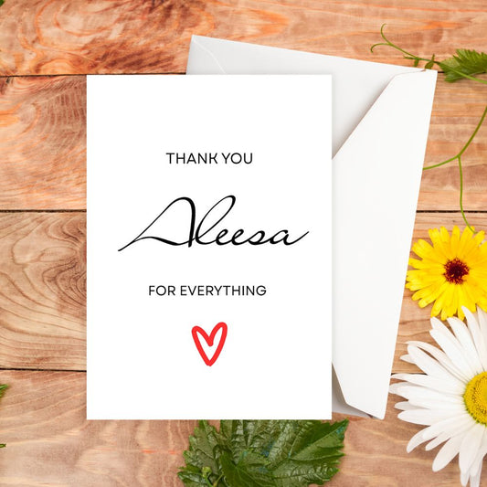 Greeting card with 'Thank you Aleesa for everything' text on a wooden surface with flowers.Aleesa Thank You Personalised Card