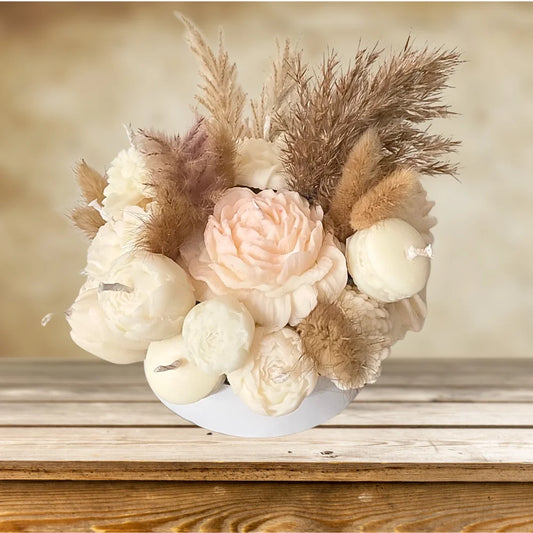 Decorative floral arrangement with pampas grass on a wooden surface. BOHO STYLE CREAM FLOWER CANDLES CENTREPIECE