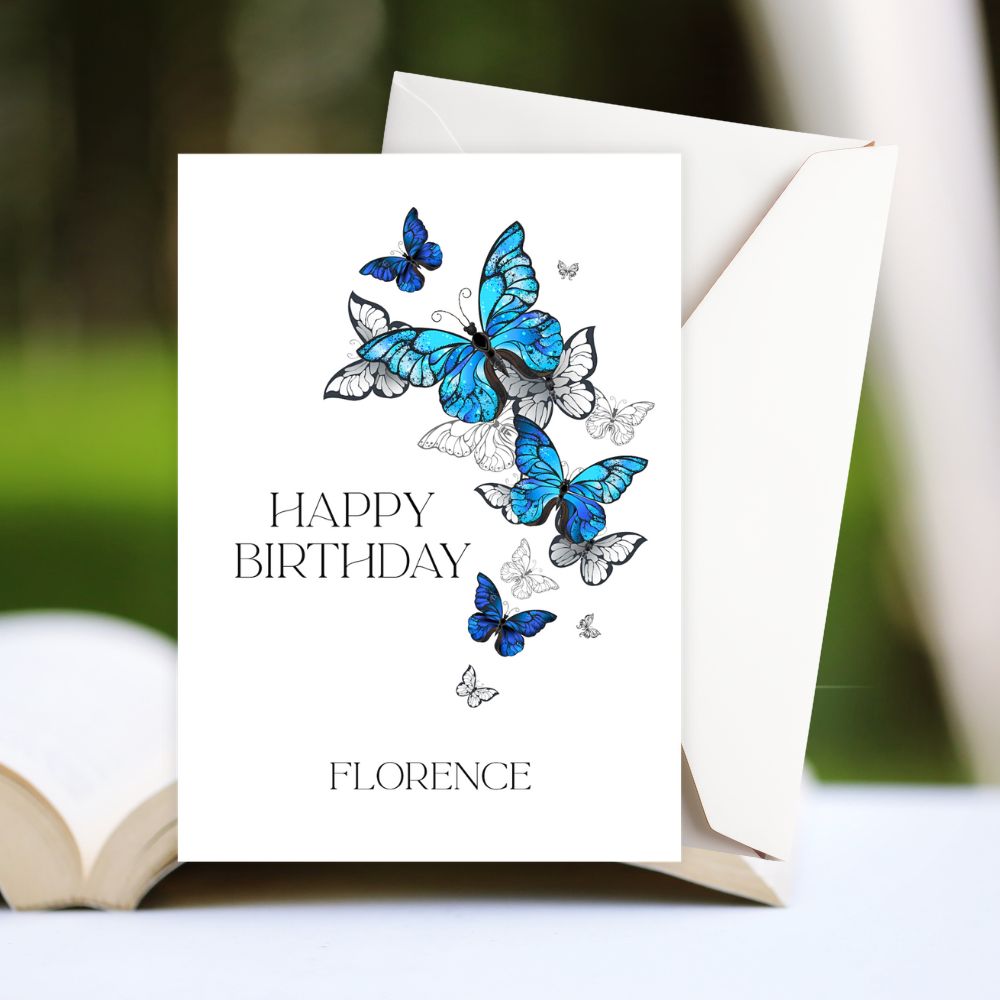Birthday card with blue butterflies and 'Happy Birthday Florence' text on a white background.