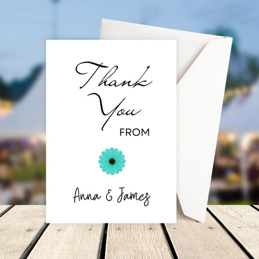 Greeting card with 'Thank You' message and floral design on a blurred outdoor background. Blue Daisy Thank You Personalised Card