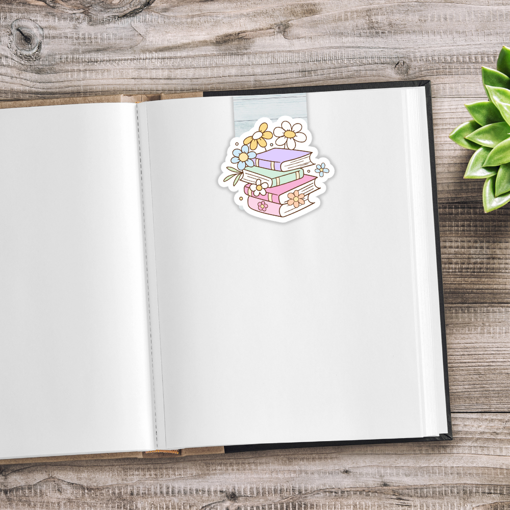 Open notebook with a decorative sticker on a wooden surface. CUTE BOOKS MAGNETIC BOOKMARK SET