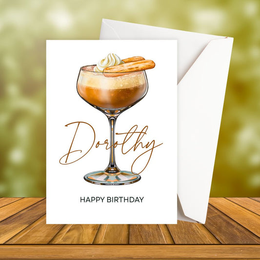 Personalised Birthday card with a cocktail illustration and 'Happy Birthday' text on a wooden surface.
