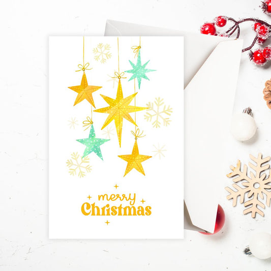 Christmas card with yellow stars and snowflakes on a white background. FALLING STARS CHRISTMAS CARD