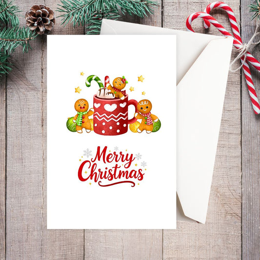 Christmas card with gingerbread men and a mug on a wooden surface with candy canes and pine cones.HOT CHOCOLATE CHRISTMAS CARD