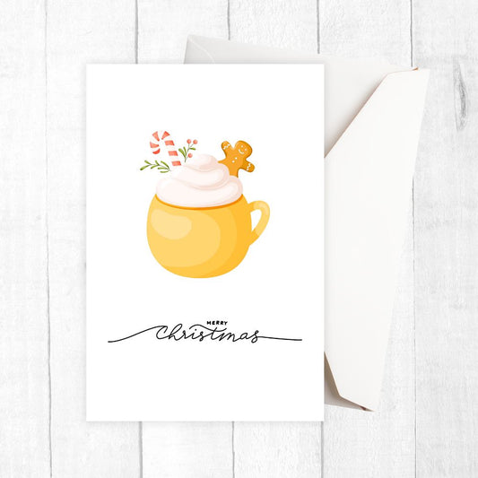 Yellow mug with whipped cream and a gingerbread man on a white background with 'Merry Christmas' text.HOT COCOA CHRISTMAS CARDS