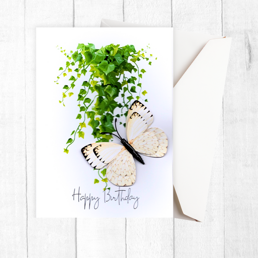 Butterfly-shaped card with green leaves and 'Happy Birthday' text on a white background