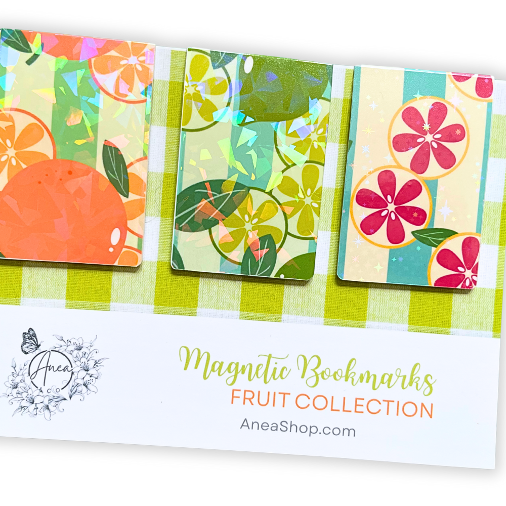 Colorful magnetic bookmarks with fruit designs on a white background, featuring the brand 'AneaShop'. Juicy Fruit Bookmark Set