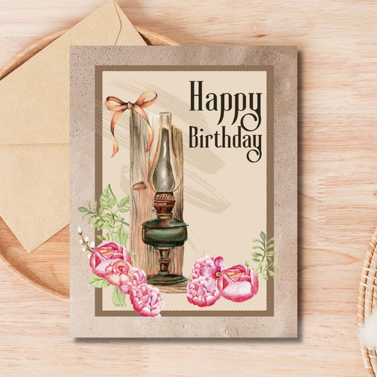Birthday card with vintage-style illustration of a lamp and flowers on a wooden surface. Lamp Vintage Happy Birthday Card