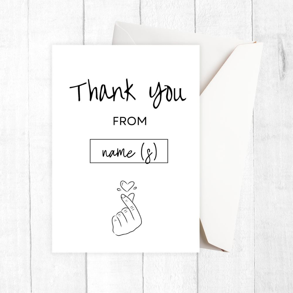 Greeting card with 'Thank you' text and envelope on a white wooden surface. Love Thank You Personalised Card