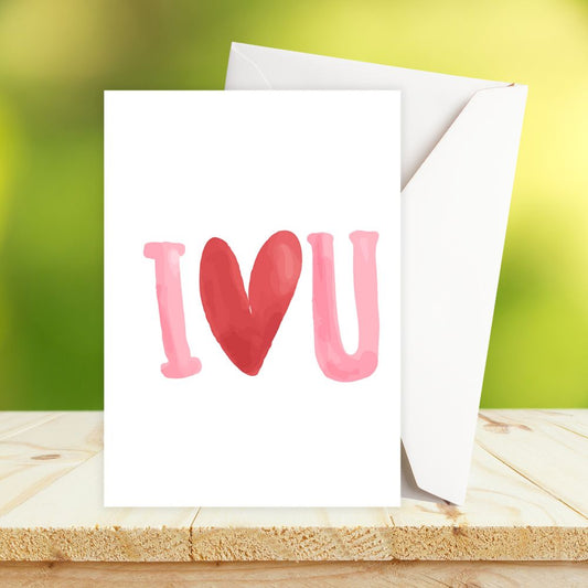 Greeting card with 'I ❤️ U' text on a wooden surface with a blurred green background. Love You Valentine's, Anniversary Card