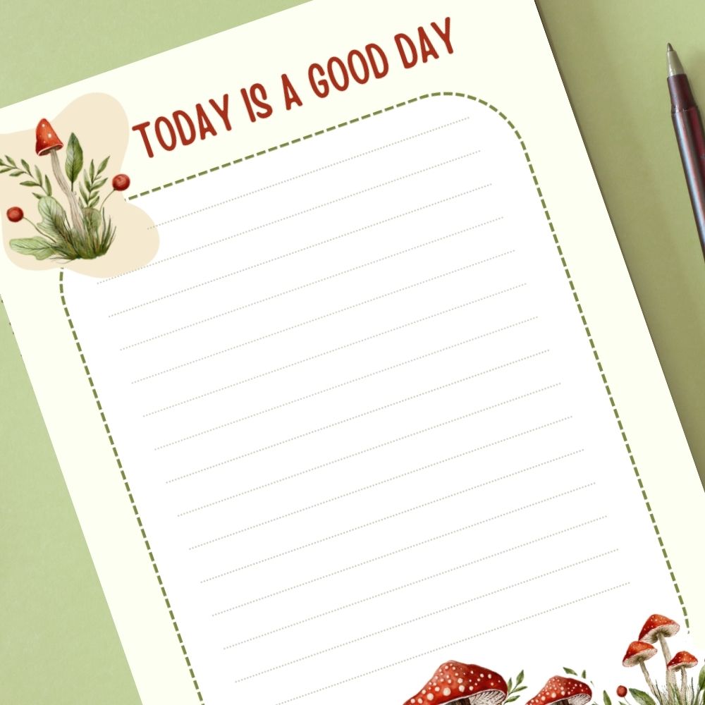 Notebook page with 'Today is a good day' text and decorative elements on a green background.MUSHROOM PERSONALISED A6 NOTEPAD