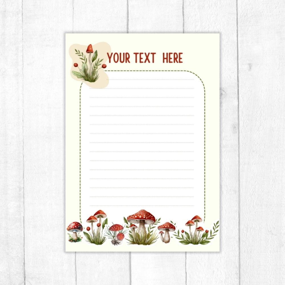 Notebook with mushroom design on a white wooden surface. MUSHROOM PERSONALISED A6 NOTEPAD