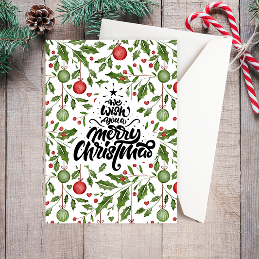 Christmas card with holly design and candy canes on a wooden surface. Mistletoe Christmas Card