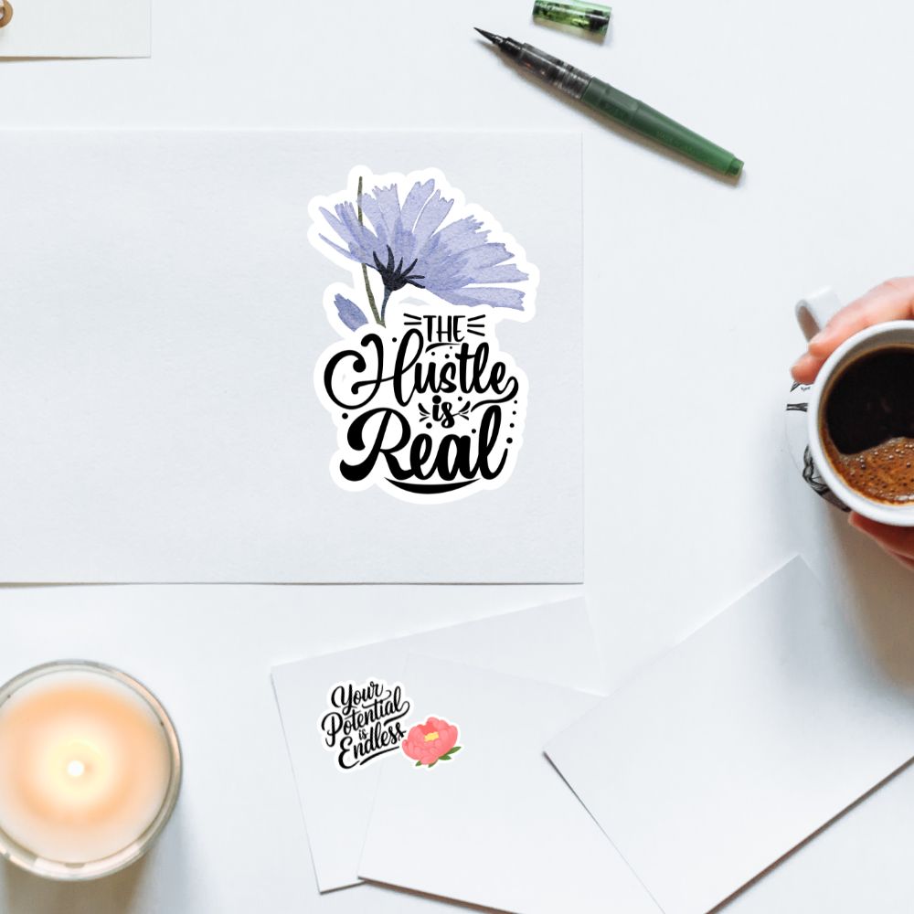 Motivational stickers on a desk with a candle, pen, and coffee cup.Motivational Quotes Sticker