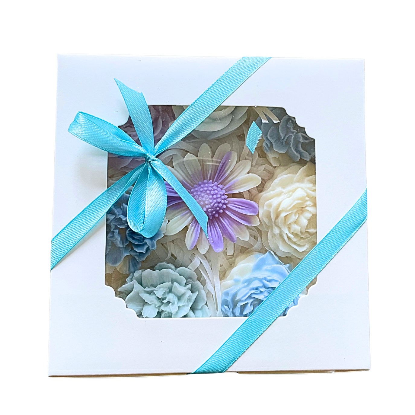 Decorative flowers in a box with a blue ribbon on a white background. PASTEL FLOWERS WAX MELTS GIFT BOX