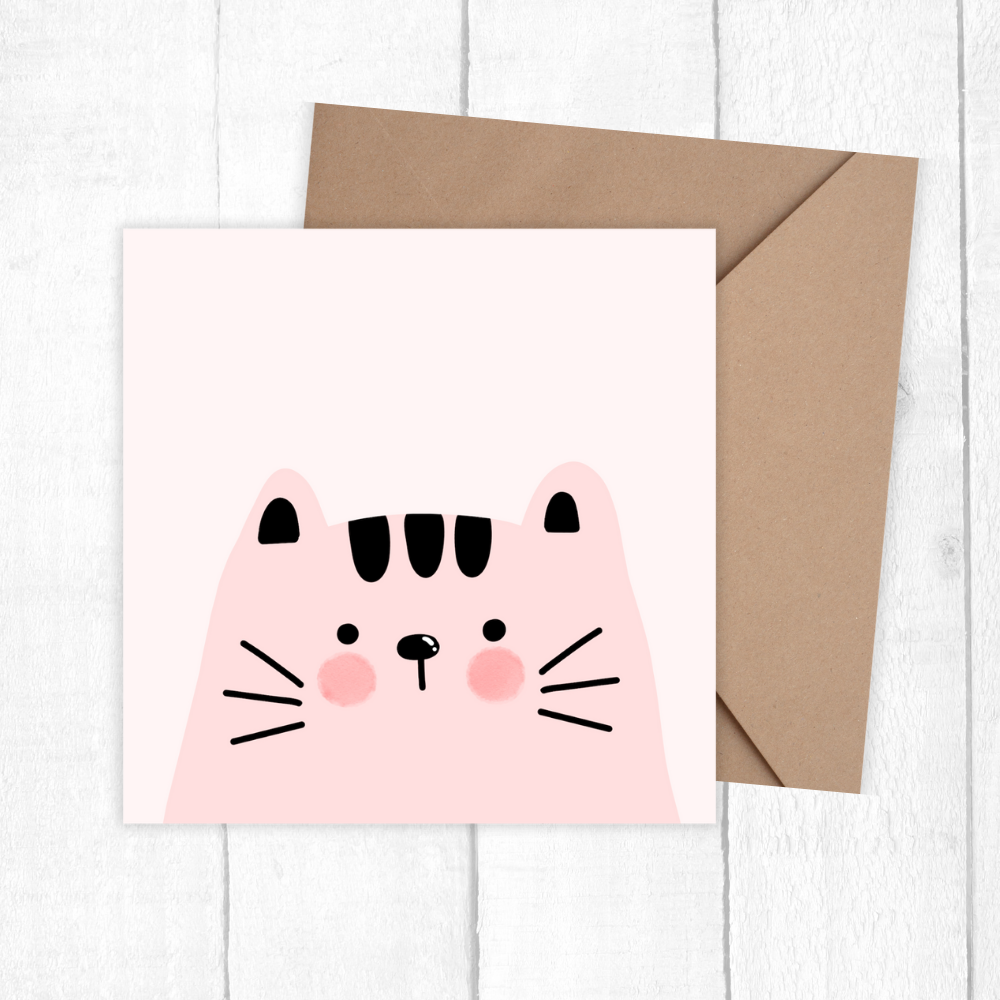 Card with a pink cat face design on a white background birthday card