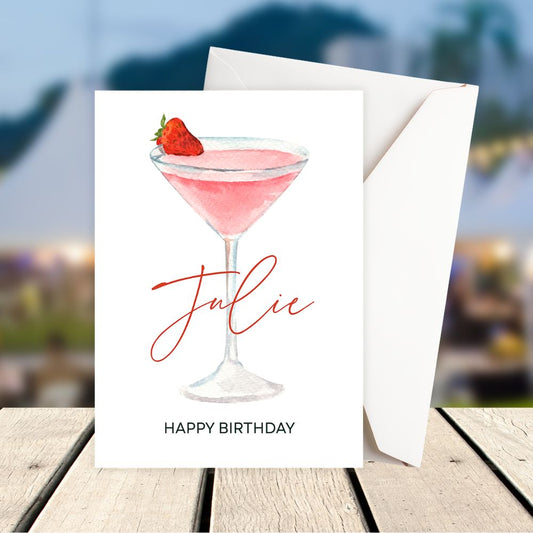 Personalised Birthday card with a pink cocktail and strawberry on a blurred outdoor background