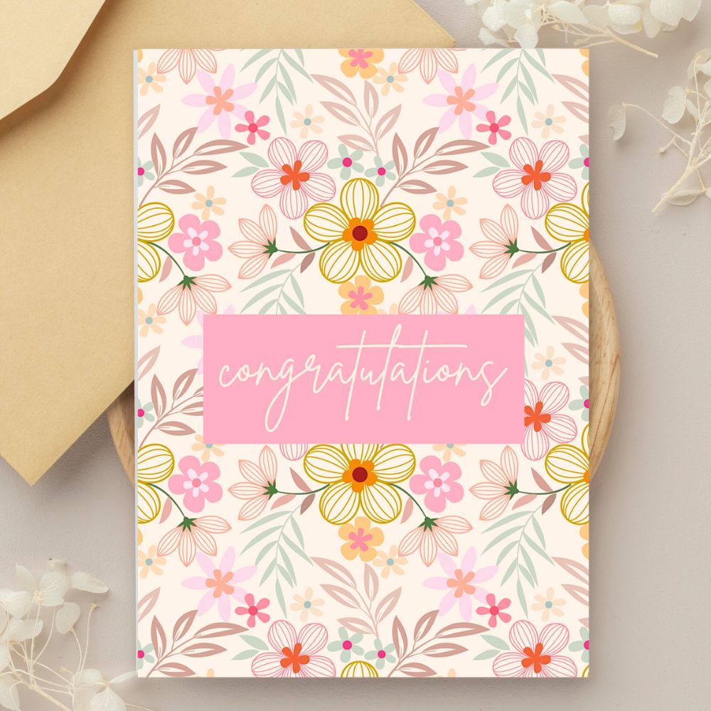 Floral congratulation card with 'congratulations' text on a beige background. Pink Wild Flowers Congratulations Card