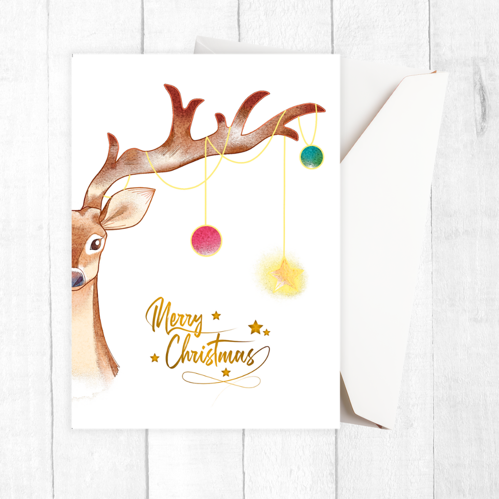 Christmas card with a reindeer and colorful ornaments on a white background. Reindeer Tree Christmas Card