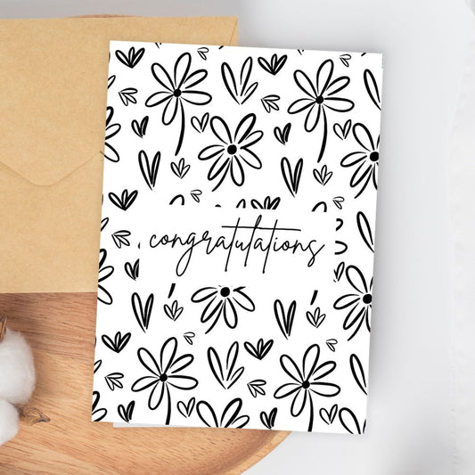 Greeting card with black floral pattern and 'congratulations' text on a white background. Sketch Flowers Congratulations Card
