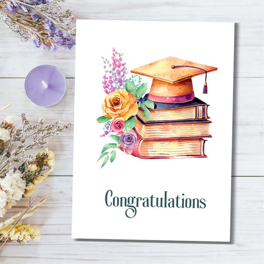 Graduation-themed card with books, cap, and flowers on a wooden surface. Vintage Books Congratulations Graduation Card 2