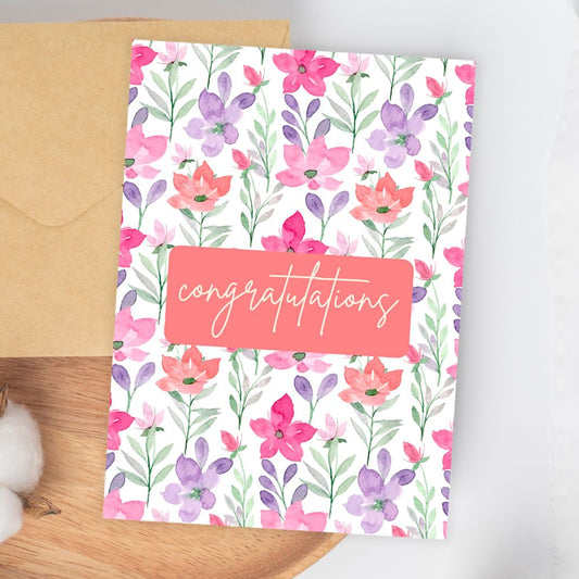 Floral congratulation card with 'congratulations' text on a white background. Watercolour Flowers Congratulations Card