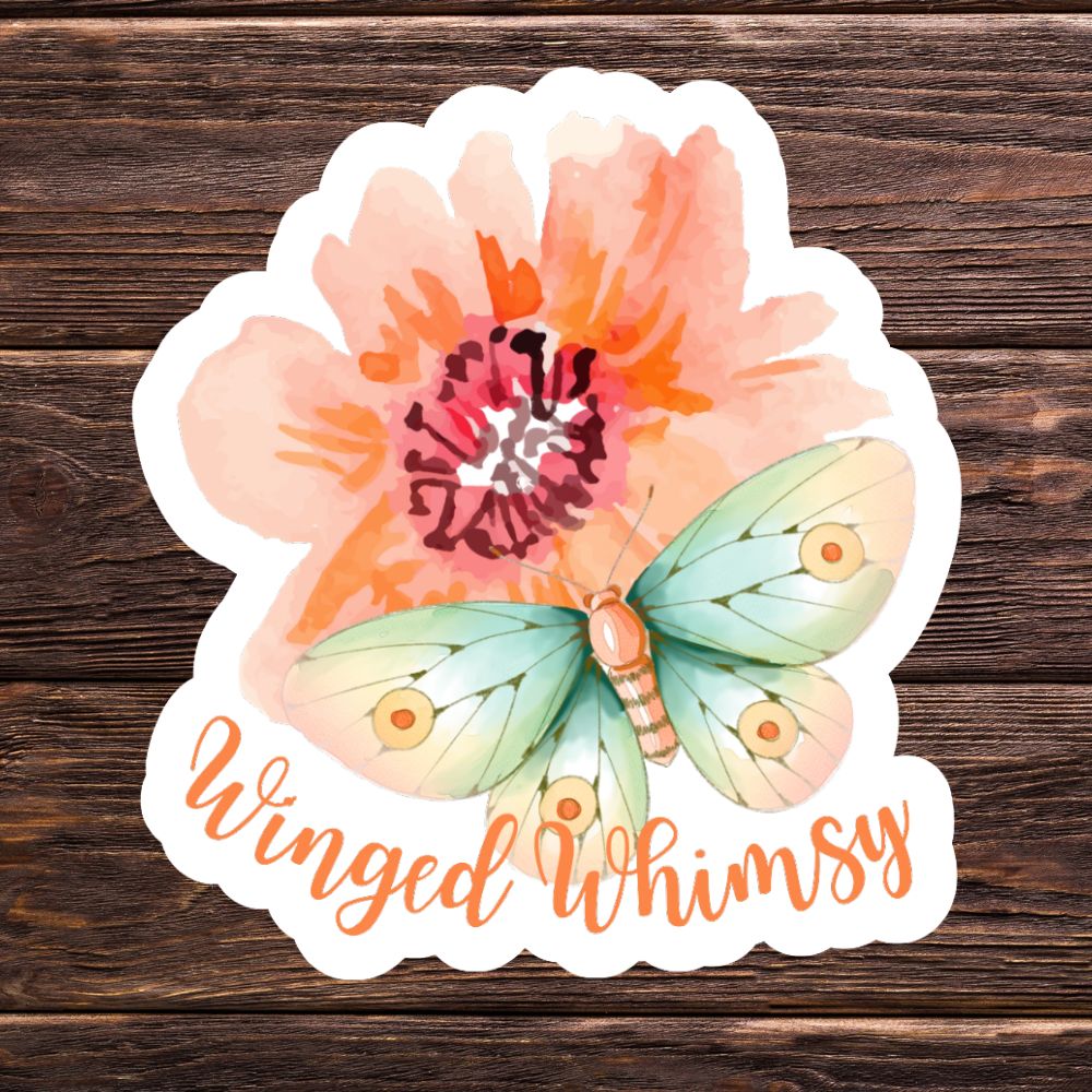 Floral and butterfly design with 'Winged Whimsy' text on a wooden background. Winged Whimsy Butterfly Sticker