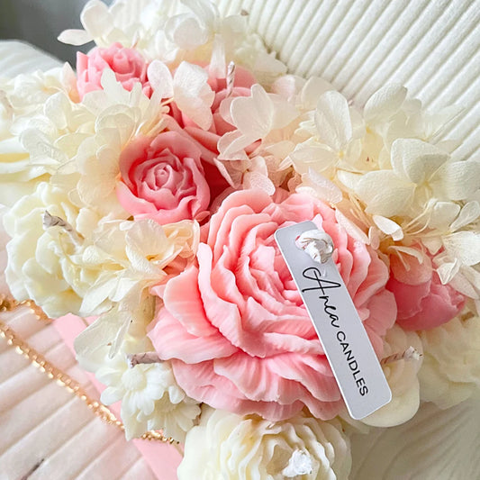 Decorative soap flowers with a 'Fleur Candles' tag on a white background. PINK CANDLE FLOWER BOUQUET BAG