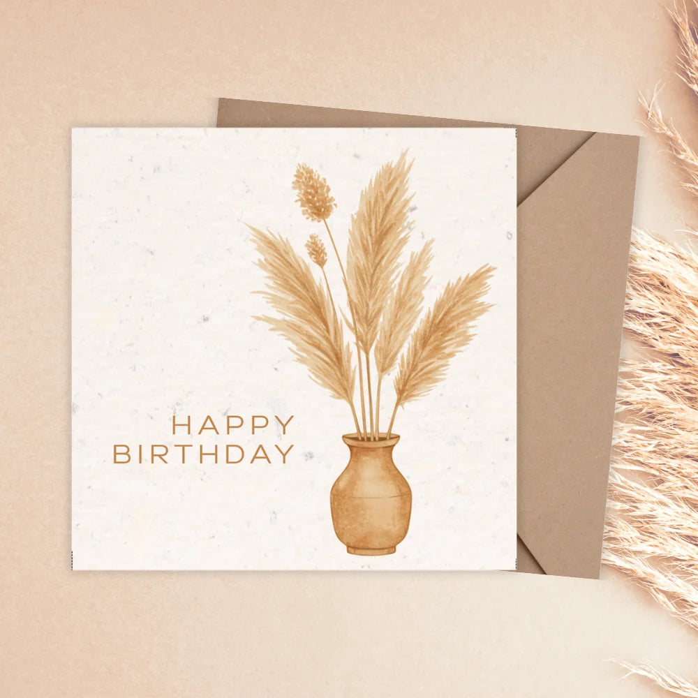 Birthday card with pampas grass and 'Happy Birthday' text on a beige background. BOHO FLOWER VASE BIRTHDAY CARD