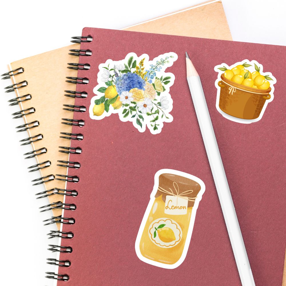 Notebook with lemon-themed stickers and a pencil on a white background. lemons sticker