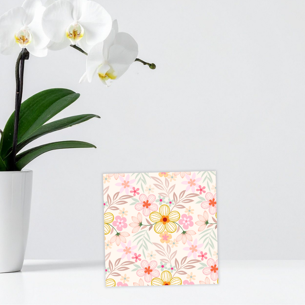 Floral patterned card with a white orchid plant on a light gray background. pastel Flowers Birthday Card