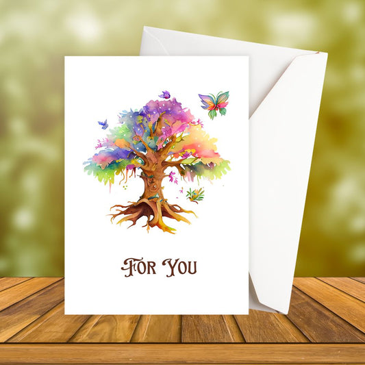 Greeting card valentine's card with a colorful tree design and butterflies on a wooden surface.