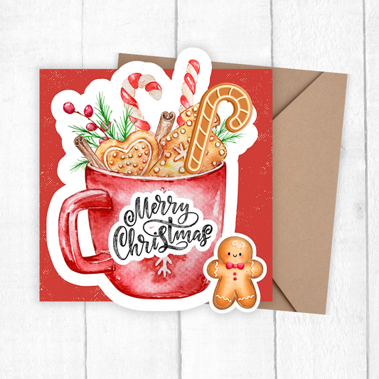 Christmas-themed greeting card with a red mug, cookies, and candy canes on a white background.