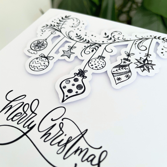 Black and white Christmas tree design with ornaments and 'Merry Christmas' text on a white background.3D Happy Holidays Ornaments Card