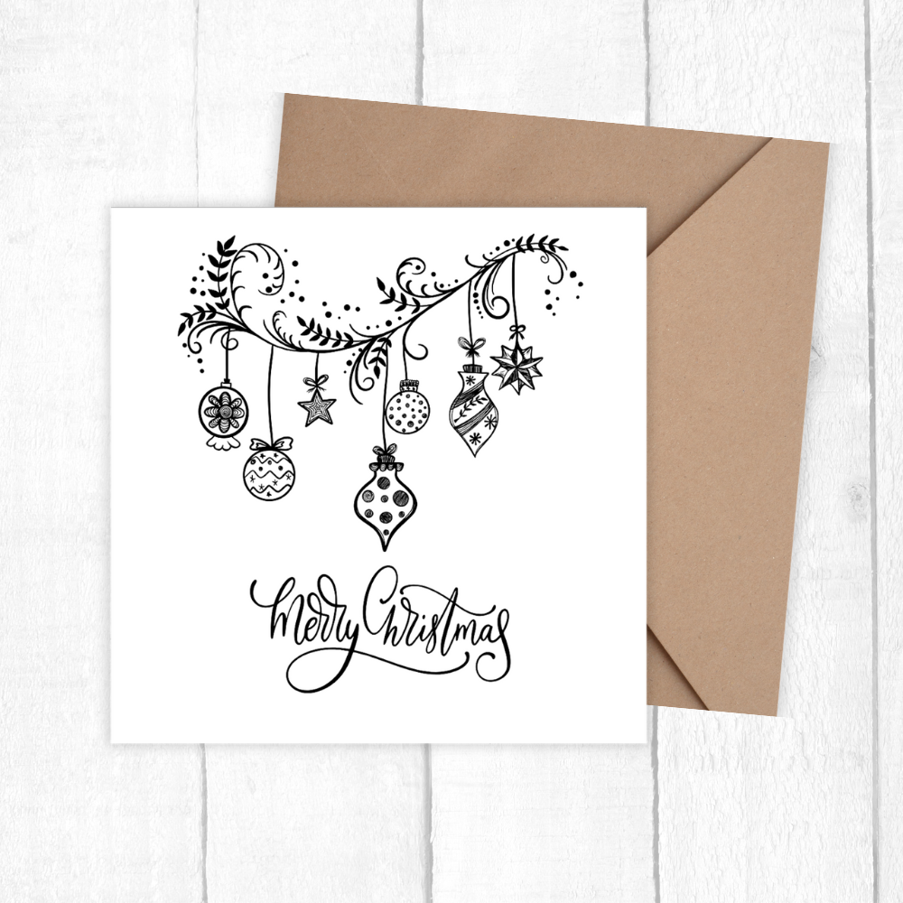 Christmas card with decorative ornaments and 'Merry Christmas' text on a white background with a brown envelope.3D Happy Holidays Ornaments Card