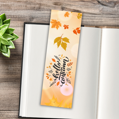 Autumn-themed bookmark with leaves and 'Hello Autumn' text on an open book.