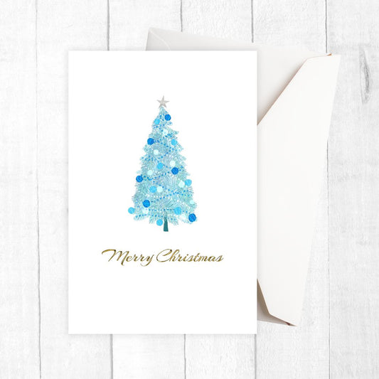 Christmas card with a blue Christmas tree and 'Merry Christmas' text on a white background. BLUE TREE CHRISTMAS CARD