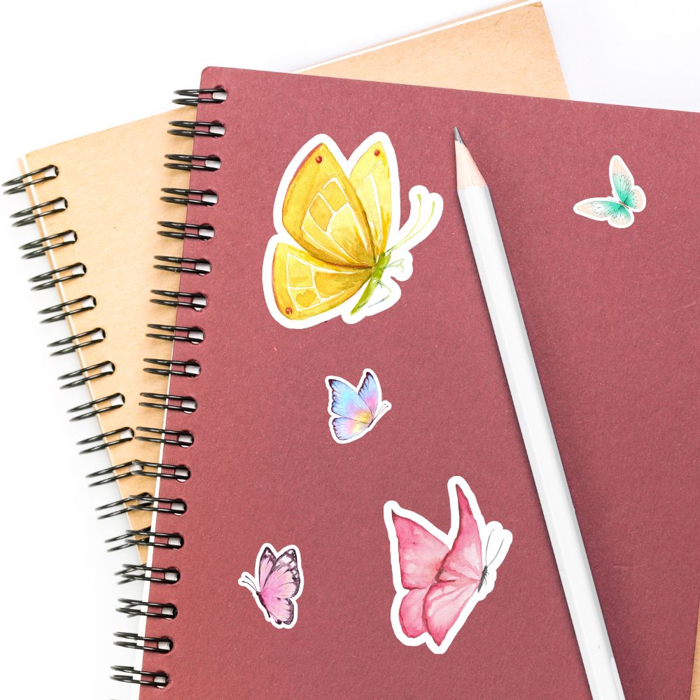 Notebook with butterfly stickers and a pencil on a white background. BUTTERFLIES STICKER