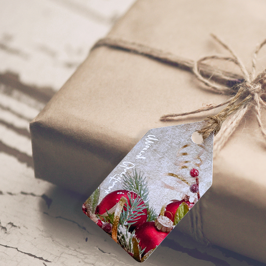 Gift wrapped in brown paper with a decorative tag featuring Christmas designs.Bauble Christmas Gift Tag Set