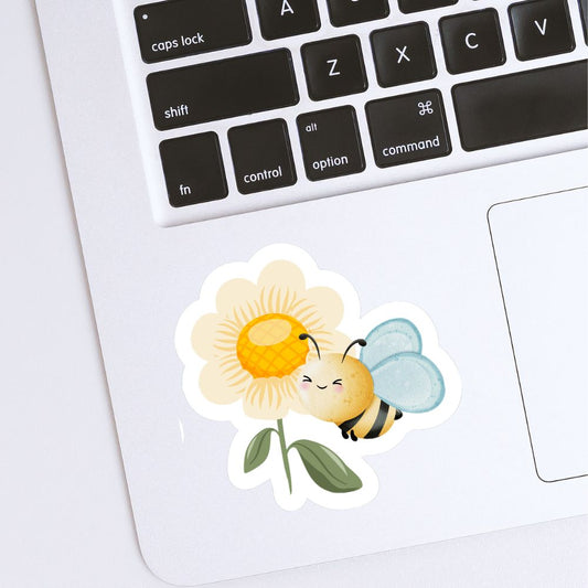 Sticker of a bee on a flower placed on a laptop keyboard. Bee and a Flower Sticker