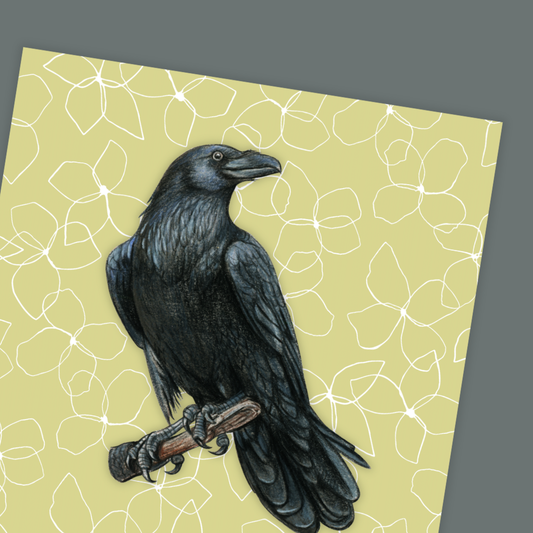 Illustration of a black crow on a branch with a floral patterned background birthday card.