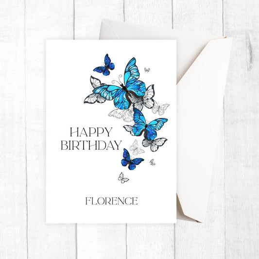 Birthday card with blue butterflies and 'Happy Birthday Florence' text on a white background