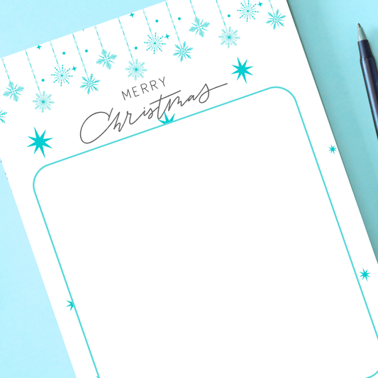 Christmas-themed notepad with decorative elements on a blue background. Blue Christmas Notepad A6 stationary