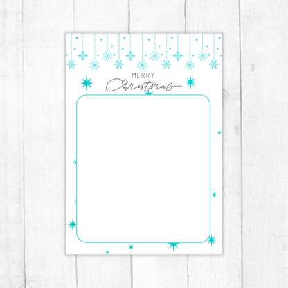 Christmas-themed card with turquoise snowflakes and 'Merry Christmas' text on a white background. Blue Christmas Notepad A6