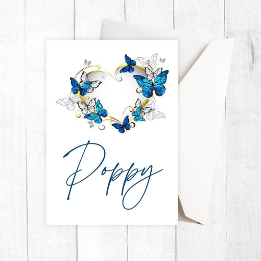 Card with blue butterflies and the name 'Poppy' on a white background. Butterflies Love Personalised Card