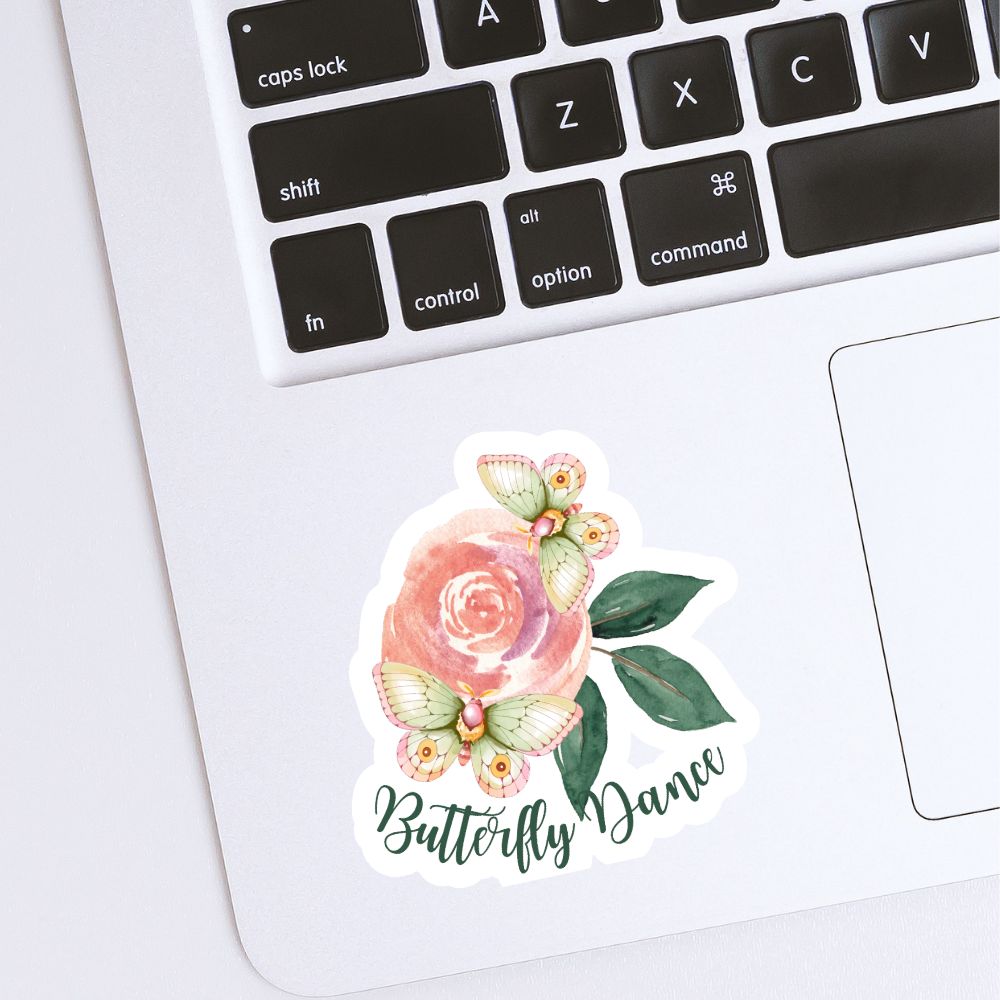 Floral sticker with 'Butterfly Dance' text on a laptop keyboard. Butterfly flower Sticker