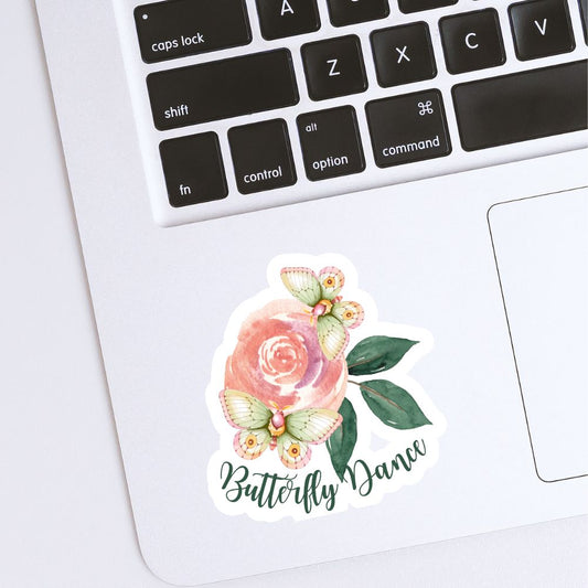 Floral sticker with 'Butterfly Dance' text on a laptop keyboard. Butterfly flower Sticker