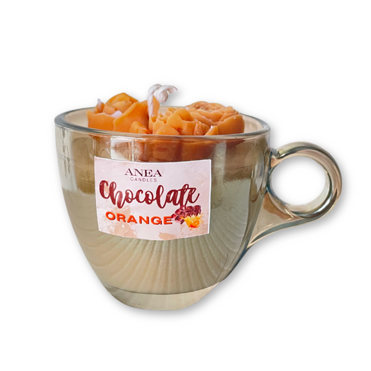 Clear mug with a candle labeled 'Chocolate Orange' by Anea Candles on a white background. CHOCOLATE ORANGE ROSES CANDLE