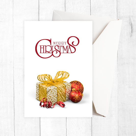 Christmas card with gold gift box, red ornaments, and 'Merry Christmas' text on a white background.CHRISTMAS CARD WITH GIFT II