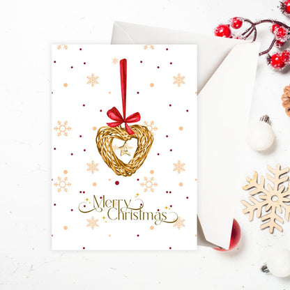 Christmas card with gold heart ornament and red bow on a white background. CHRISTMAS DECORATION CHRISTMAS CARD